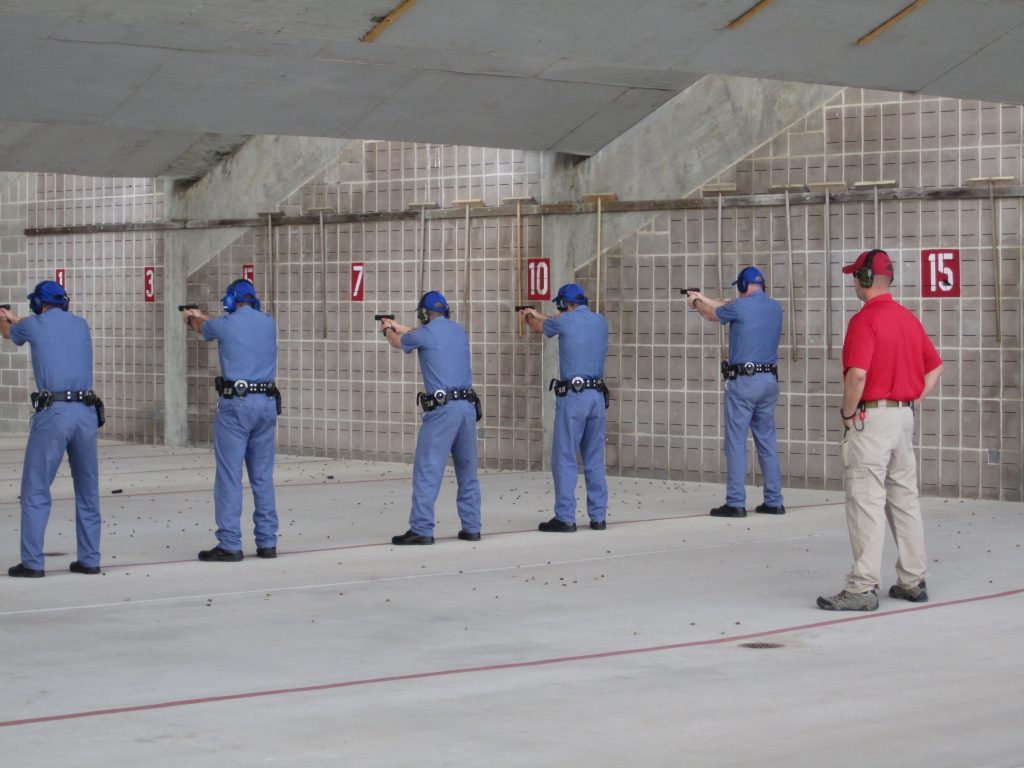 Cadets practice with firearms at a shooting range.