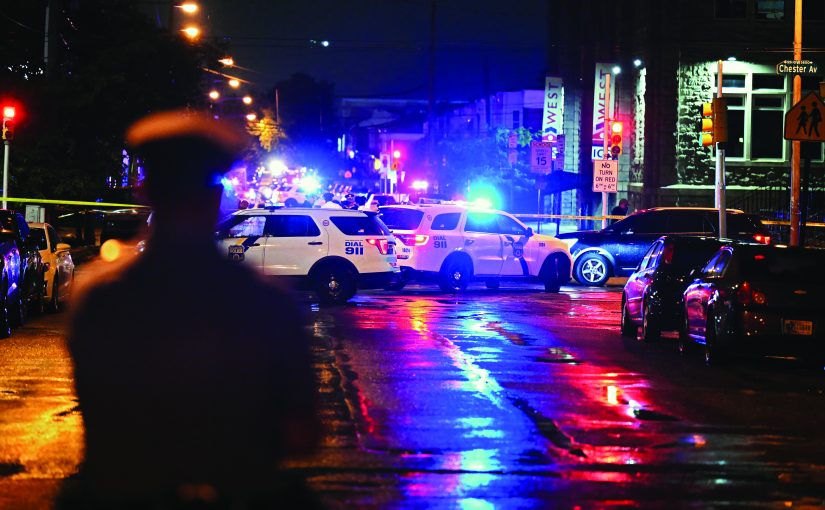 PHILADELPHIA, PENNSYLVANIA - JULY 3: Police work the scene of a shooting on July 3, 2023 in Philadelphia, Pennsylvania. Early reports say the suspect is in custody after shooting 6 people in the Kingsessing section of Philadelphia on July 3rd.