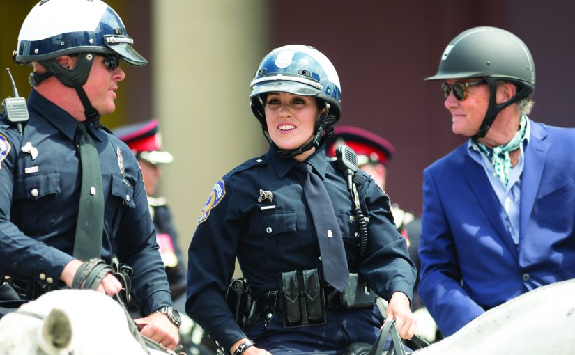 Indianapolis, Indiana, USA - May 26, 2018, Police officers on horses going down the street at the Indy 500 Parade