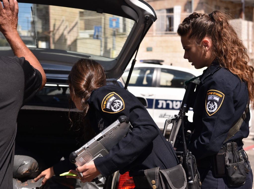 Israel Police Officer and Police Car - Police Chief Magazine