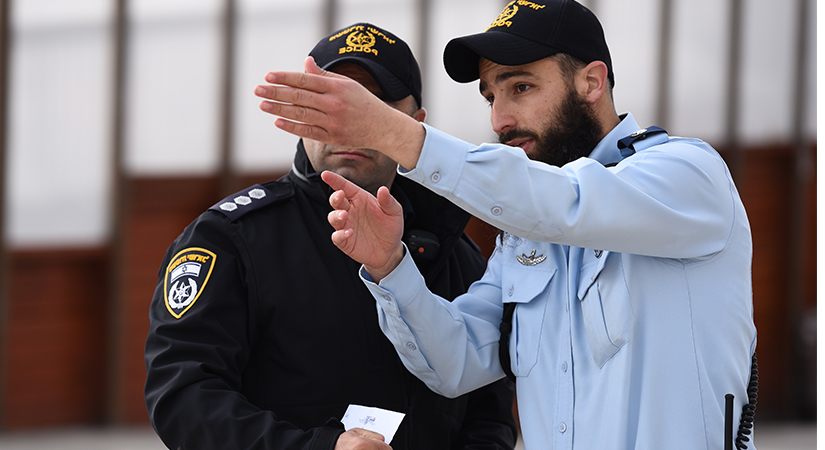 Israel Police Officer and Police Car - Police Chief Magazine